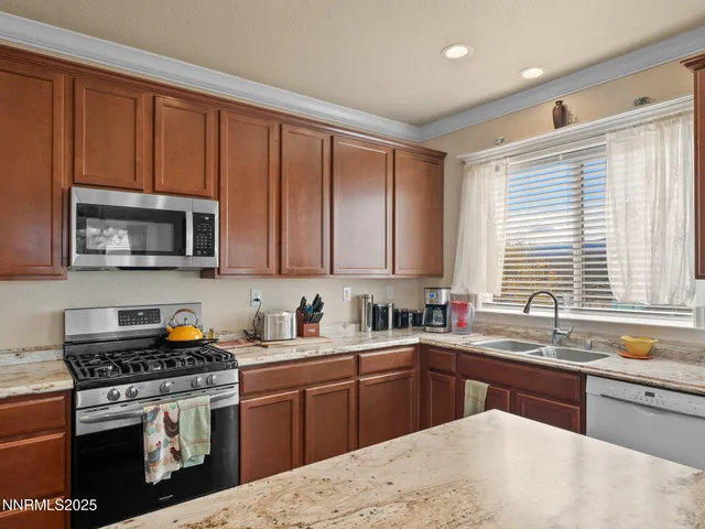 a view of a swimming pool with a chair and tables