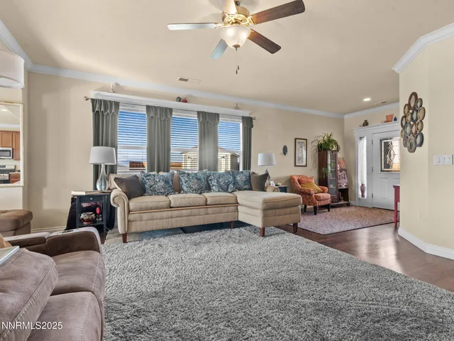 a kitchen with a refrigerator a stove a sink cabinets and a wooden floor