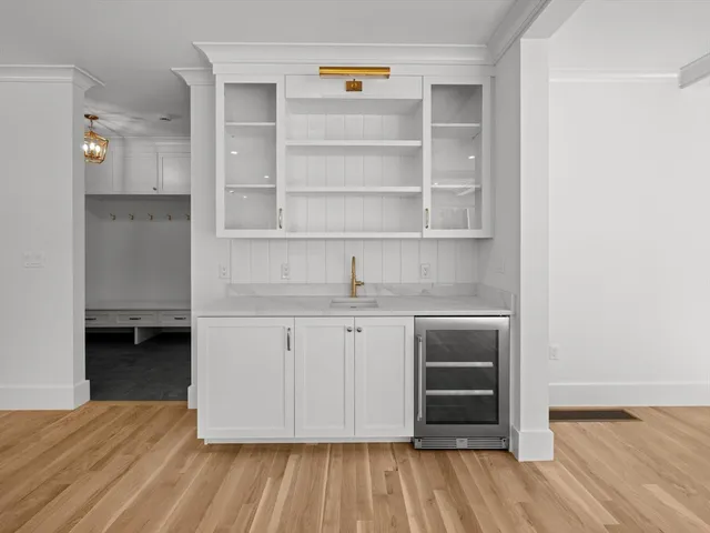 a kitchen with a sink and a stove top oven
