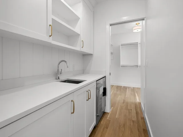 a kitchen with a sink and cabinets