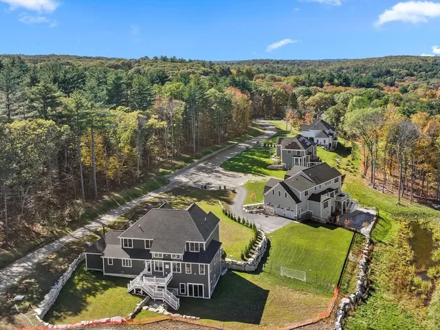 an aerial view of residential houses with outdoor space