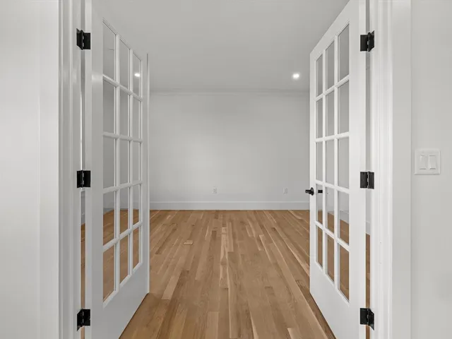 a view of a bathroom with wooden floor and staircase