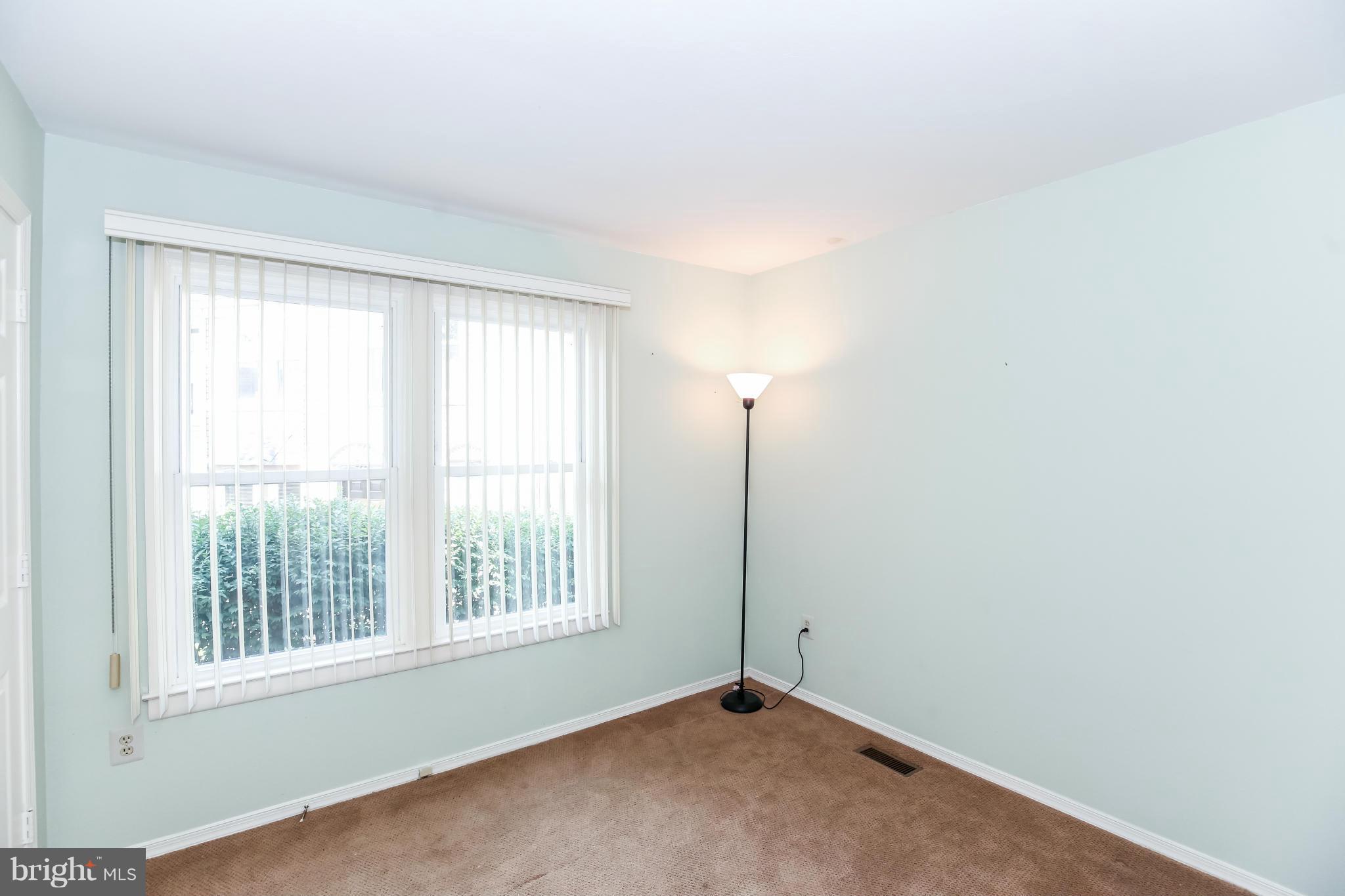 1748 Wilcox Lane Silver Spring, MD 20906 - Photo 12 of 19 a view of an empty room with a window
