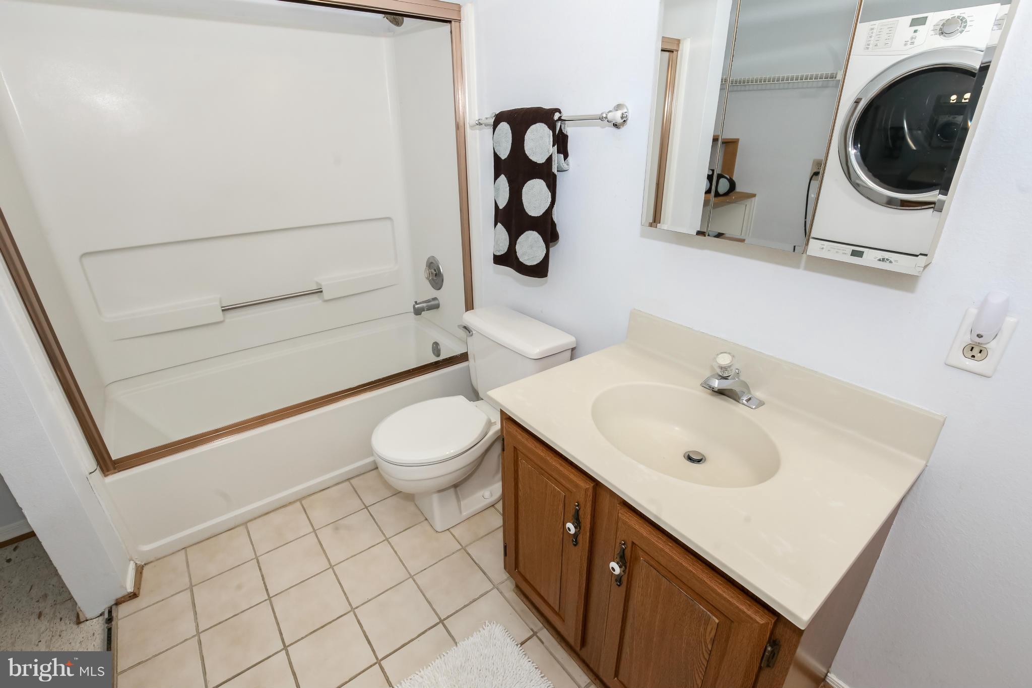 1748 Wilcox Lane Silver Spring, MD 20906 - Photo 14 of 19 a bathroom with a sink a toilet and mirror