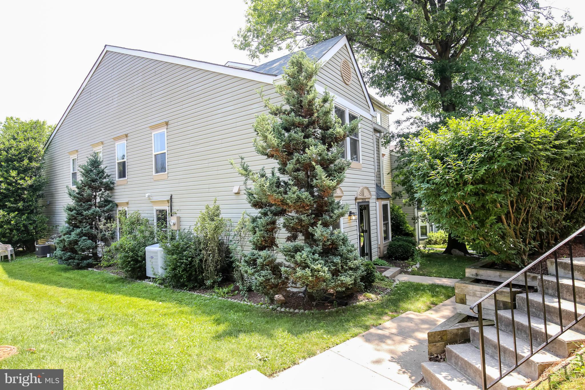 1748 Wilcox Lane Silver Spring, MD 20906 - Photo 16 of 19 a front view of a house with garden