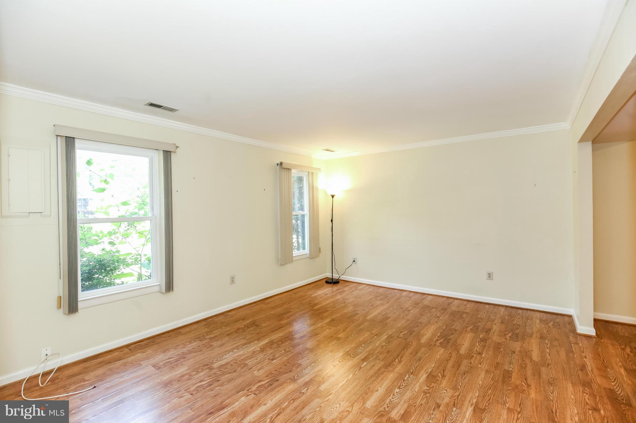 1748 Wilcox Lane Silver Spring, MD 20906 - Photo 6 of 19 an empty room with wooden floor and windows