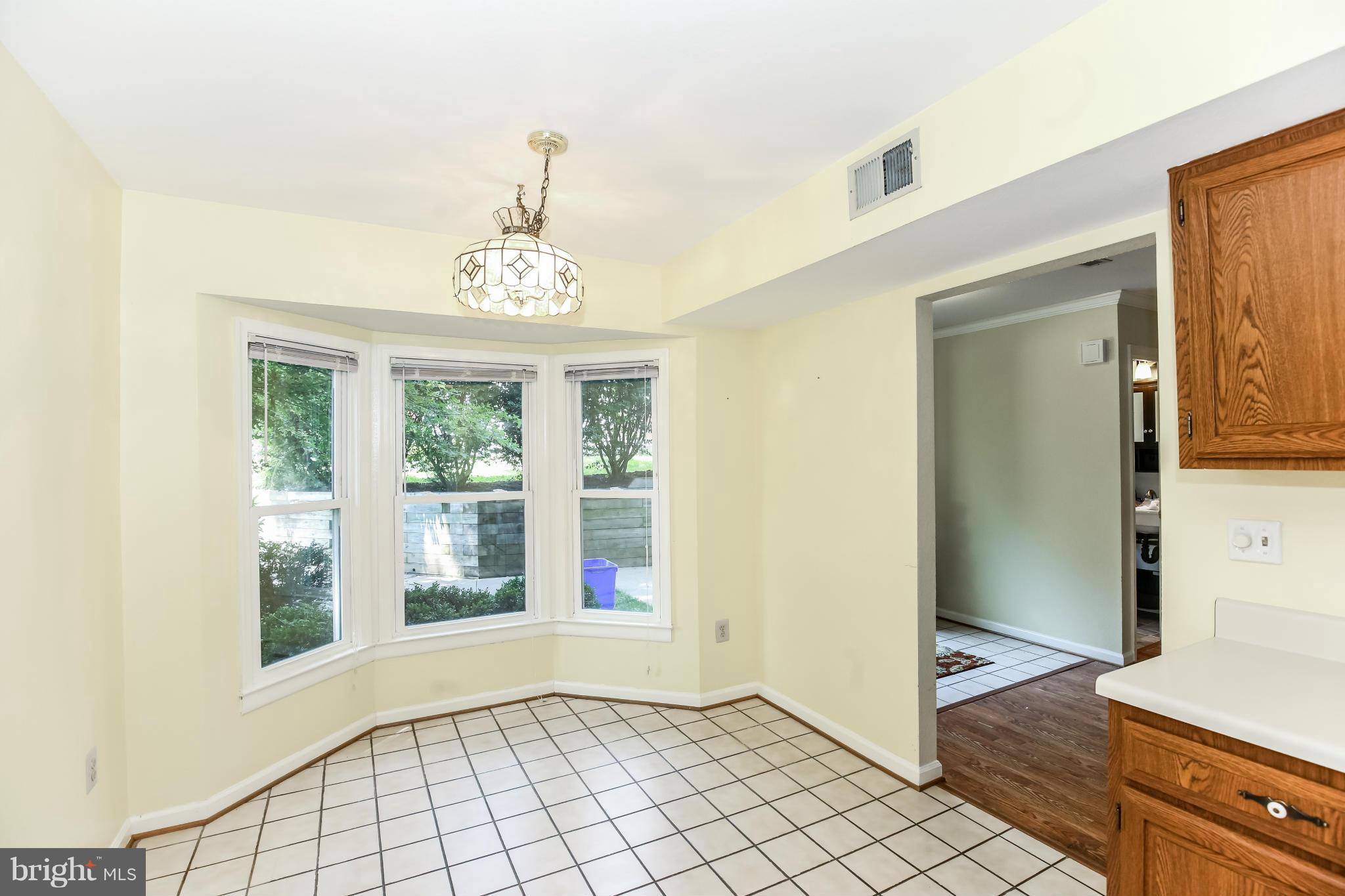 1748 Wilcox Lane Silver Spring, MD 20906 - Photo 8 of 19 a view of an entryway with wooden floor and windows