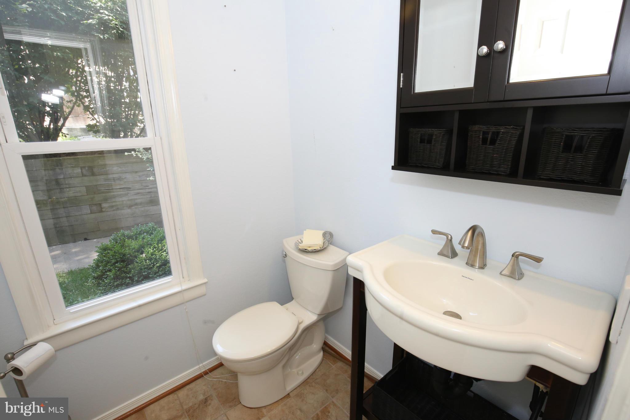 1748 Wilcox Lane Silver Spring, MD 20906 - Photo 9 of 19 a bathroom with a sink and a toilet