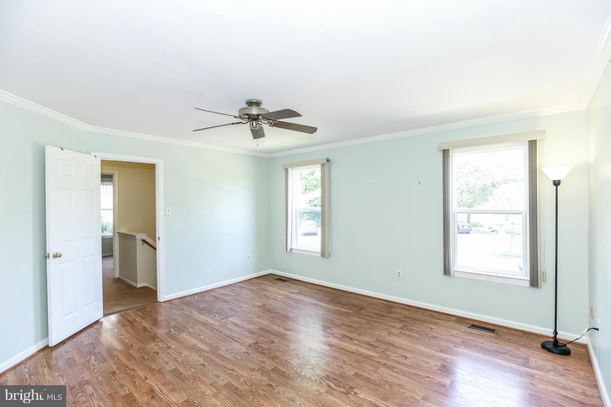 1748 Wilcox Lane Silver Spring, MD 20906 - Photo 10 of 19 a view of empty room with wooden floor and fan
