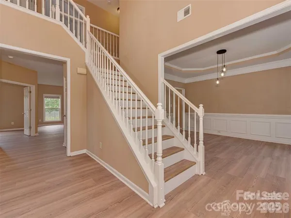 a view of entryway with wooden floor