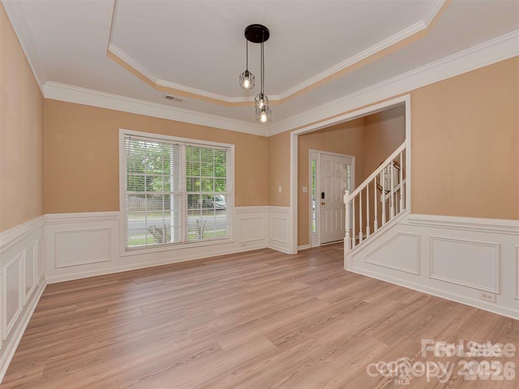 5607 Fulton Ridge Drive Indian Trail, NC 28079 - Photo 4 of 44 a view of an empty room with a window and wooden floor