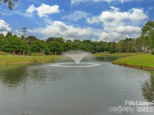a view of a water fountain and an outdoor space
