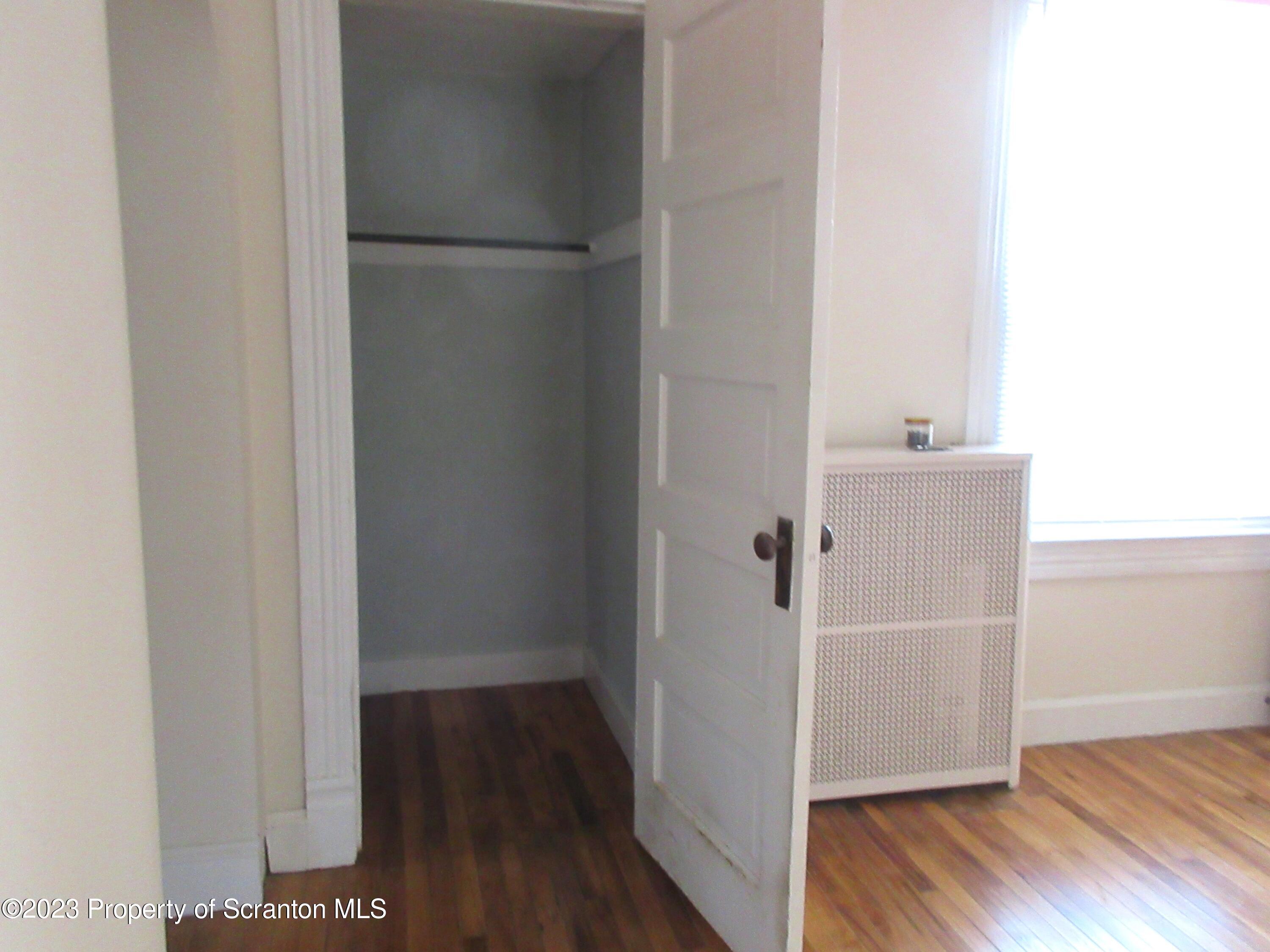 705 North Main Avenue Scranton, PA 18504 - Photo 13 of 25 a view of a hallway with wooden floor