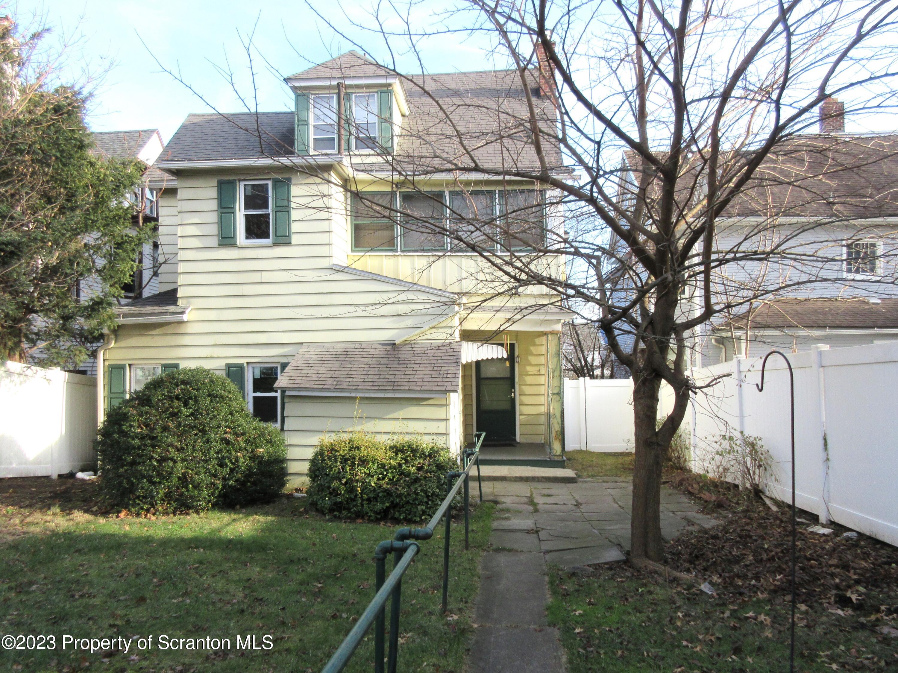 705 North Main Avenue Scranton, PA 18504 - Photo 2 of 25 a front view of a house with a yard
