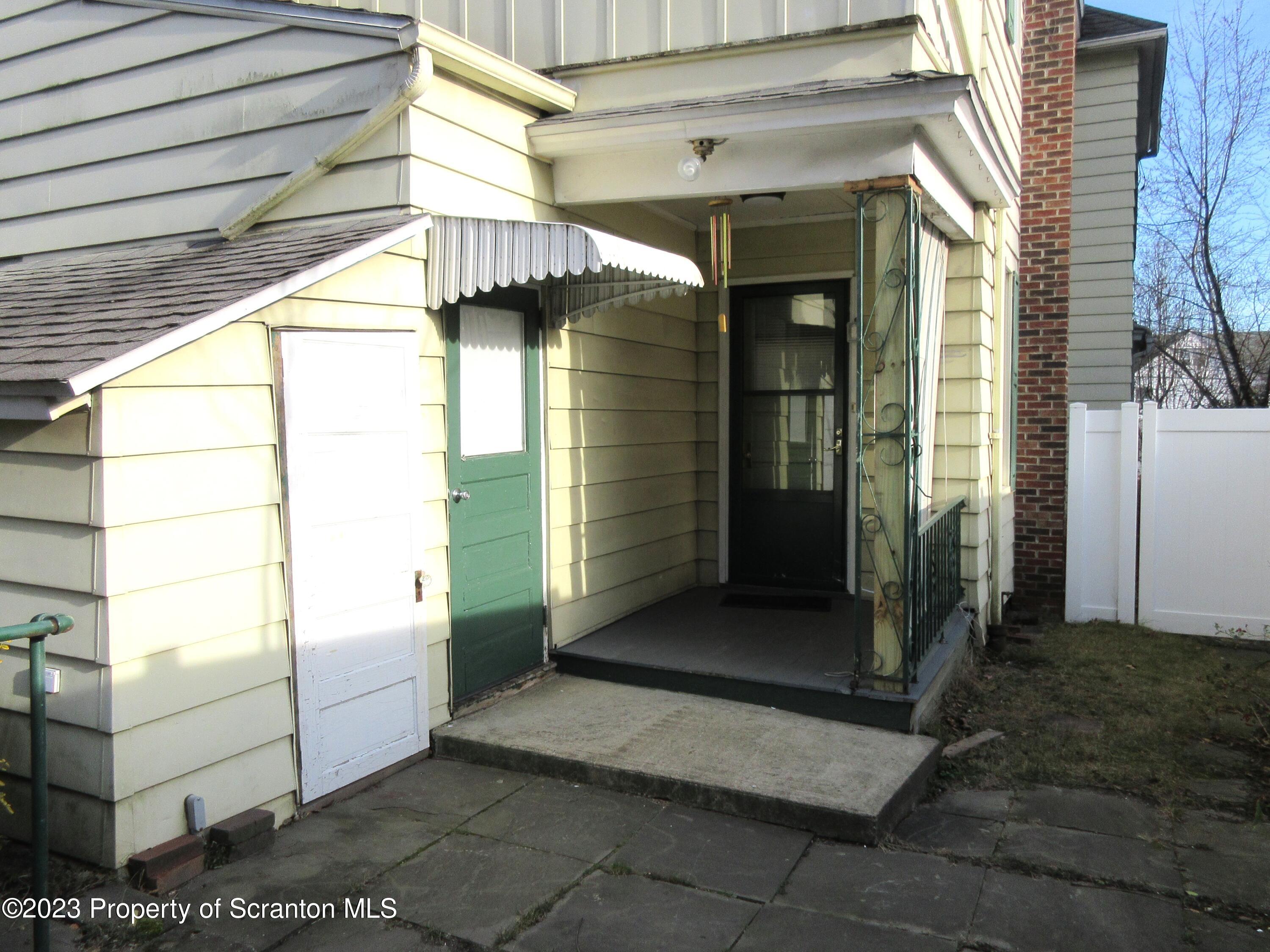 705 North Main Avenue Scranton, PA 18504 - Photo 6 of 25 a view of a porch with a door