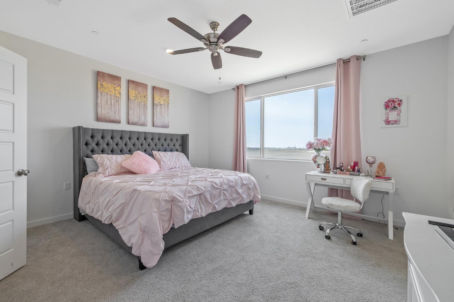 2409 Pepperdine Street Lemoore, CA 93245 - Photo 24 of 50 a bedroom with a bed and a chair