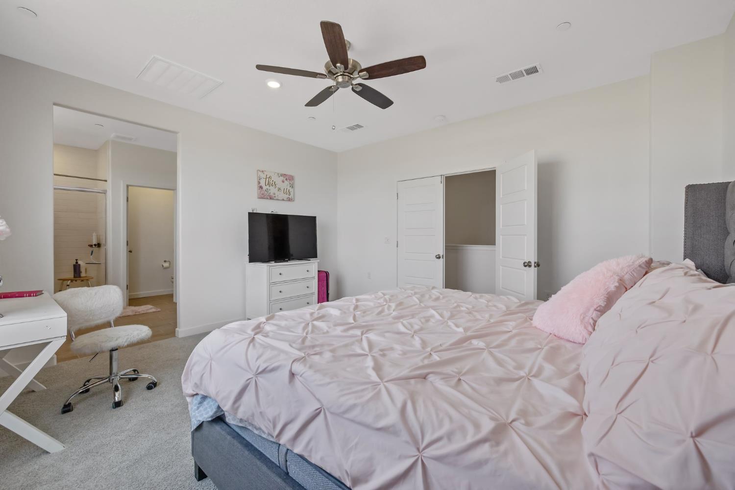 2409 Pepperdine Street Lemoore, CA 93245 - Photo 25 of 50 a bedroom with a bed and a flat screen tv