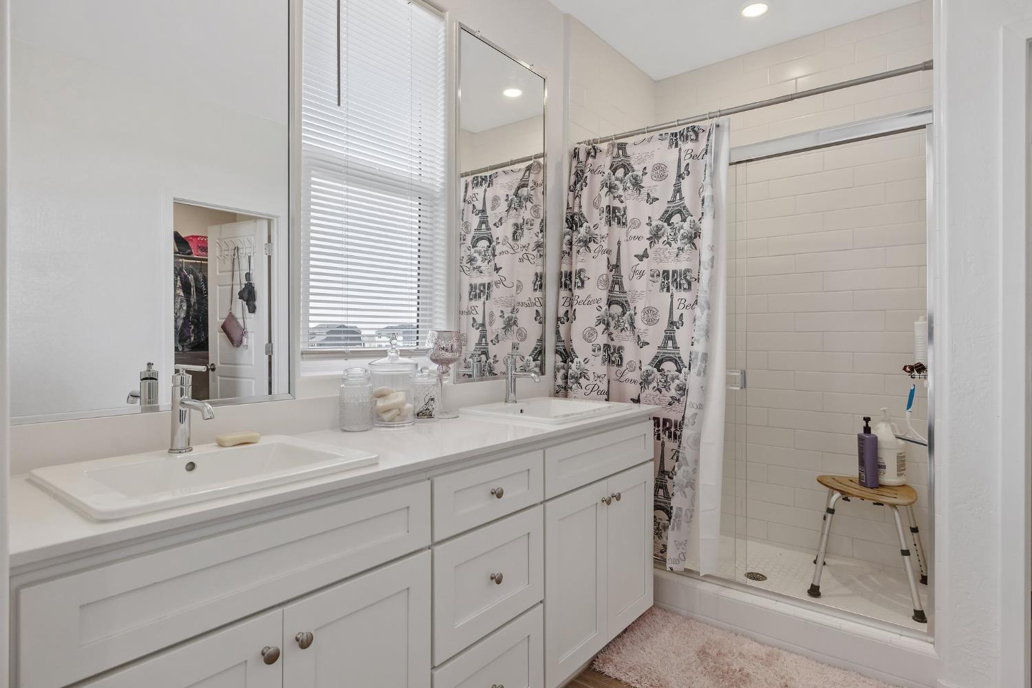 2409 Pepperdine Street Lemoore, CA 93245 - Photo 27 of 50 a bathroom with a double vanity sink mirror and shower