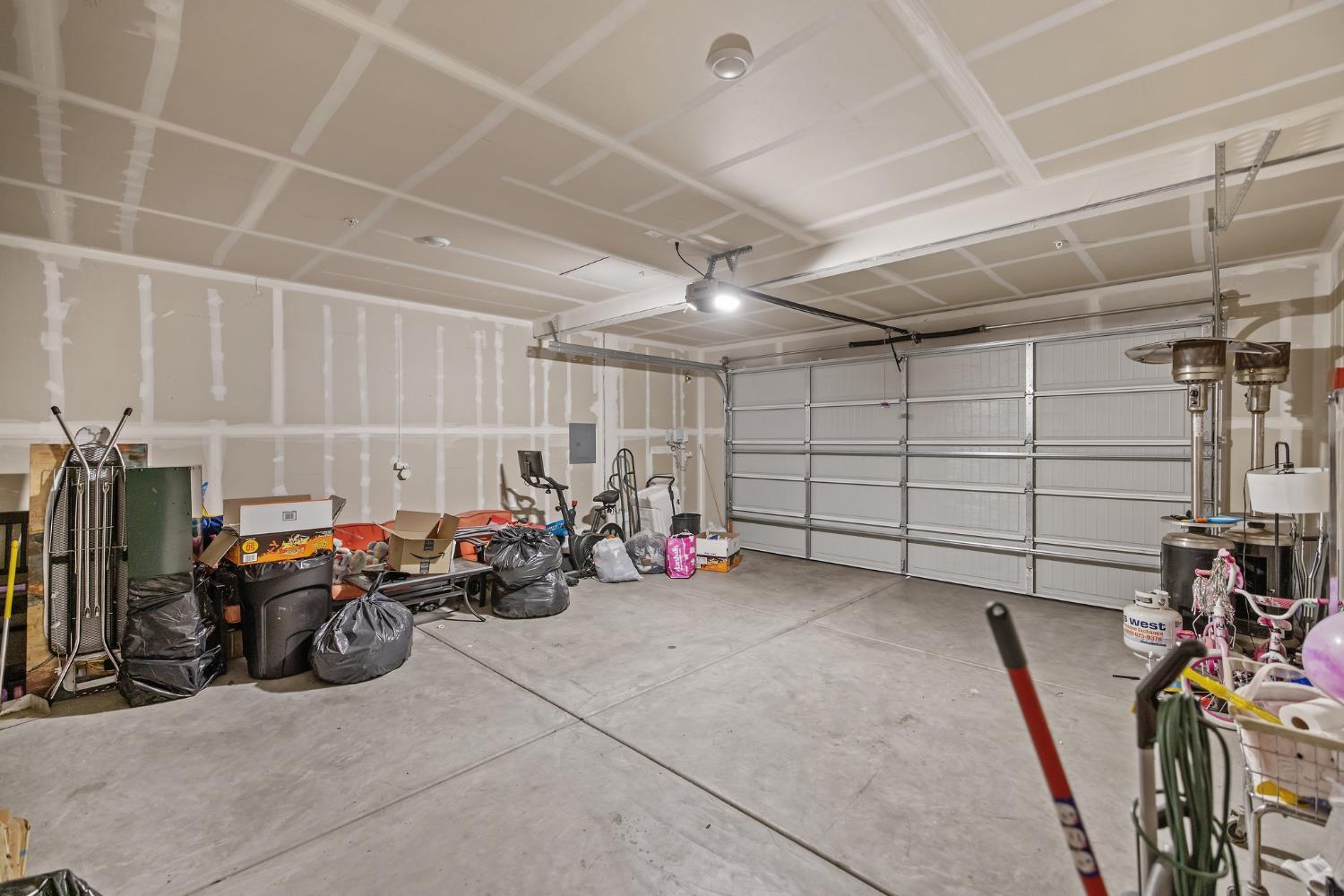 2409 Pepperdine Street Lemoore, CA 93245 - Photo 33 of 50 a view of a garage with a bike and car