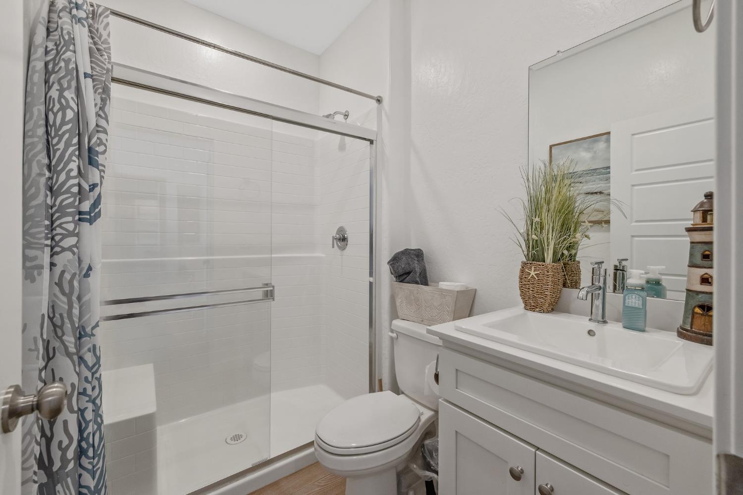 2409 Pepperdine Street Lemoore, CA 93245 - Photo 36 of 50 a bathroom with a sink toilet and shower