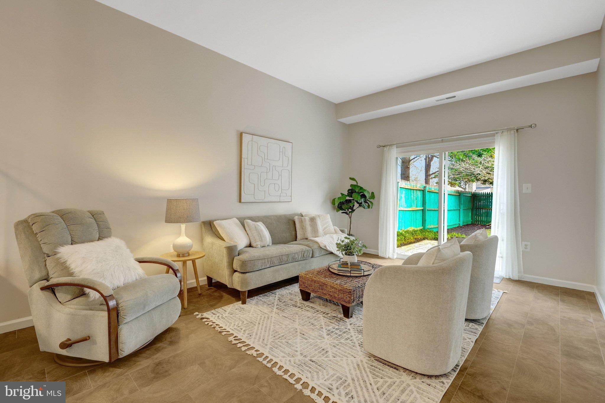 1008 Moore Place Southwest Vienna, VA 22180 - Photo 12 of 55 a living room with furniture and a large window