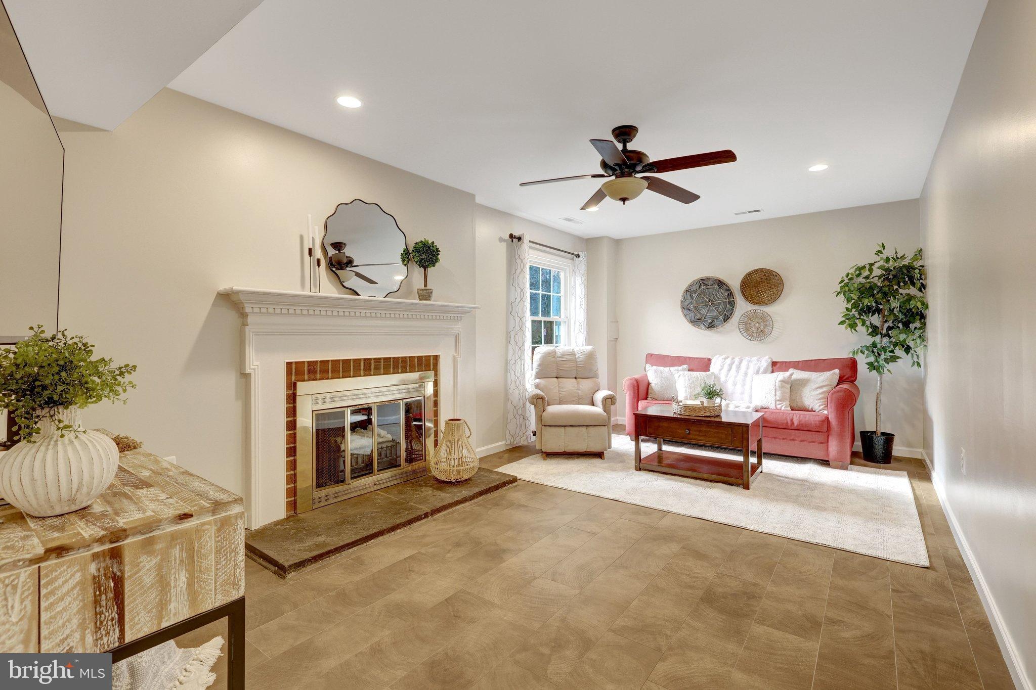 1008 Moore Place Southwest Vienna, VA 22180 - Photo 15 of 55 a living room with furniture and a fireplace
