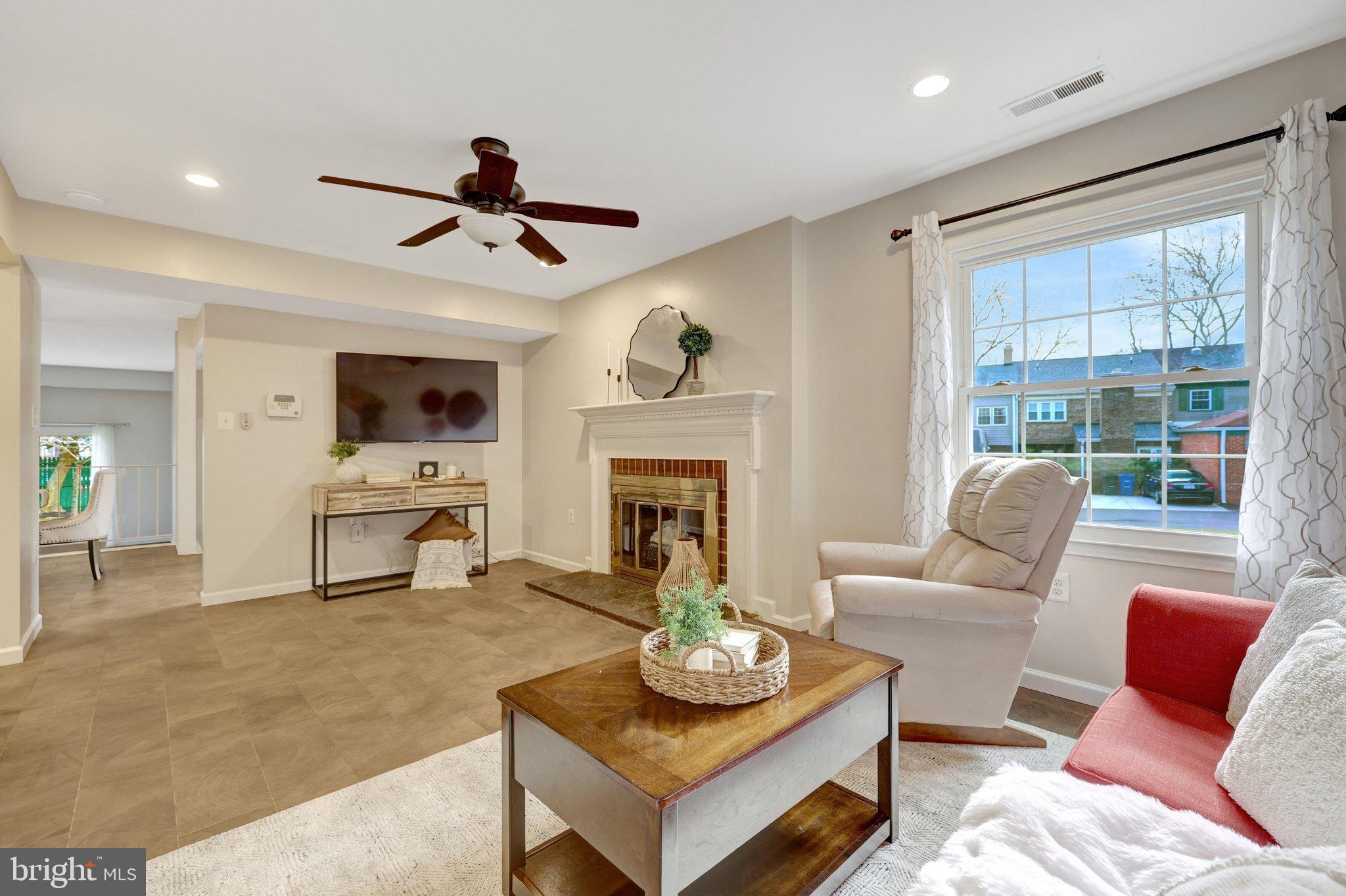 1008 Moore Place Southwest Vienna, VA 22180 - Photo 16 of 55 a living room with furniture fireplace and flat screen tv