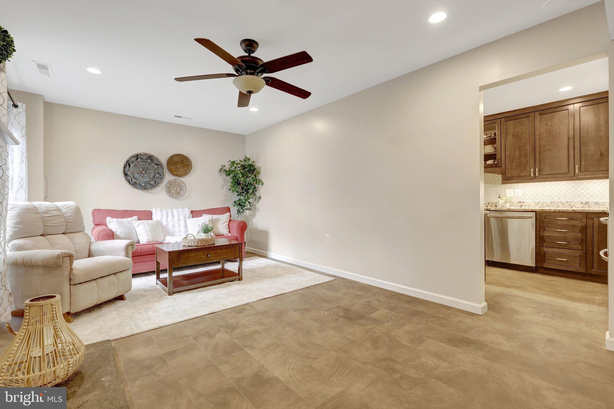 1008 Moore Place Southwest Vienna, VA 22180 - Photo 17 of 55 a living room with furniture and kitchen view