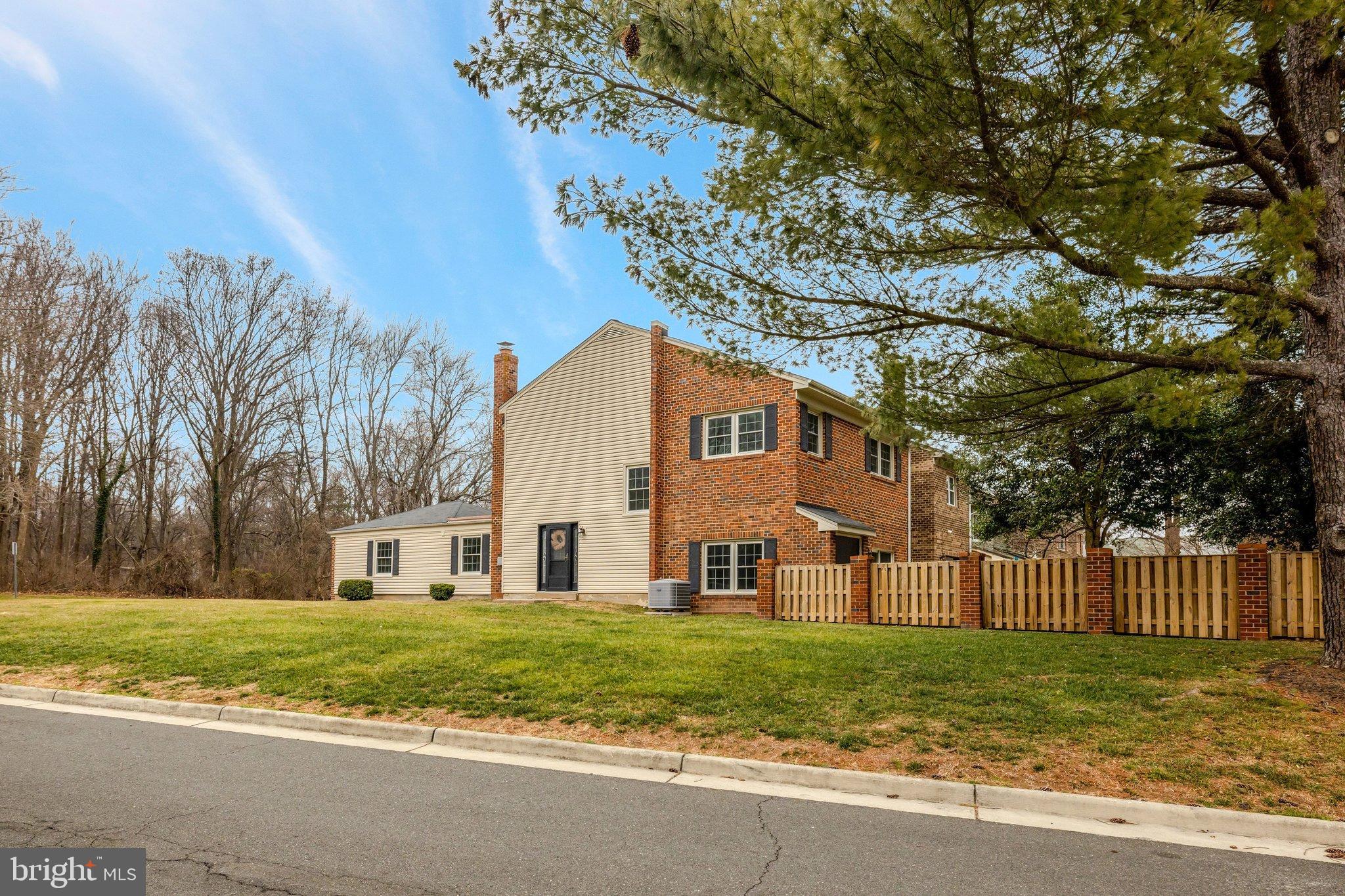 1008 Moore Place Southwest Vienna, VA 22180 - Photo 2 of 55 a view of a house with a yard