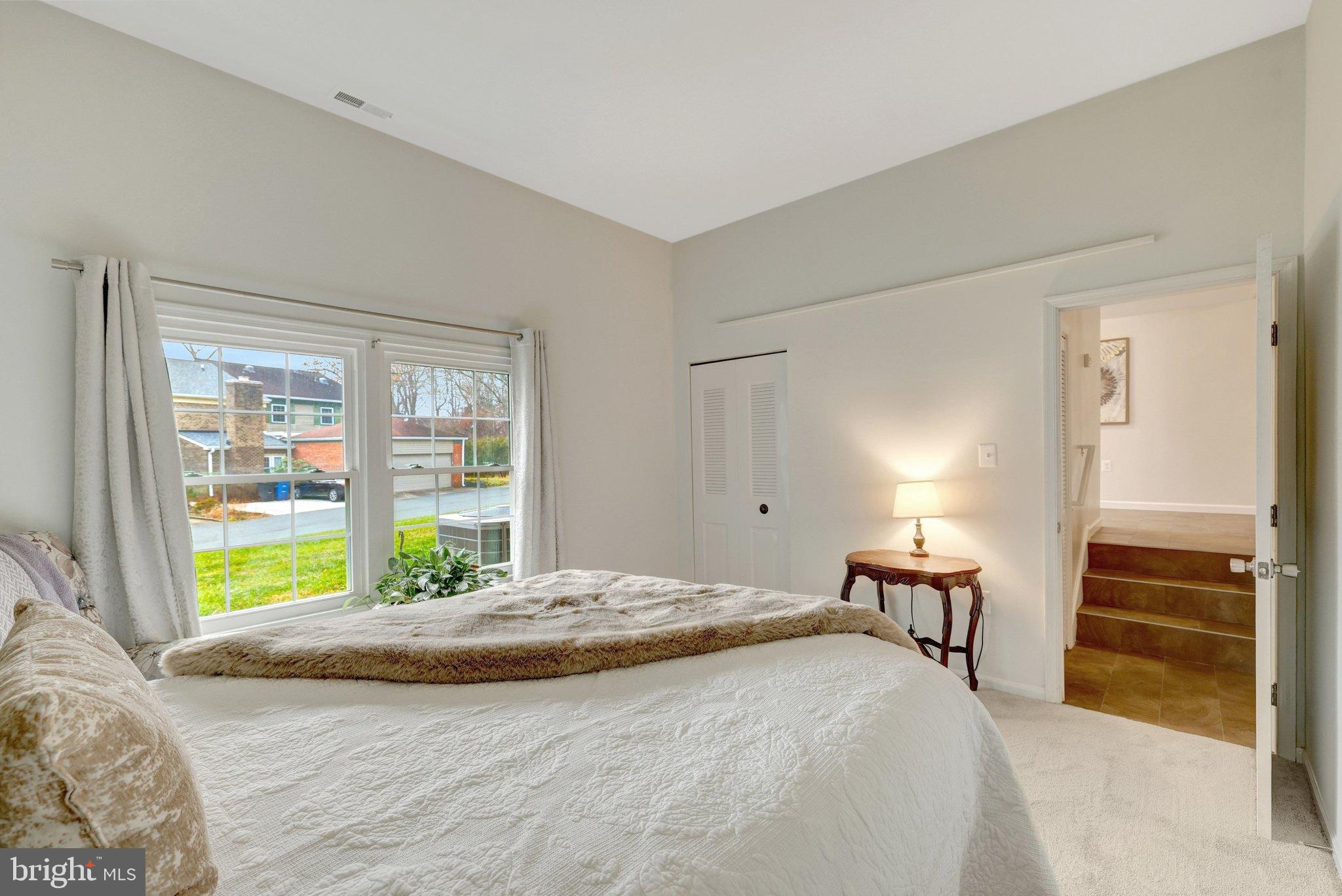 1008 Moore Place Southwest Vienna, VA 22180 - Photo 25 of 55 a bed sitting in a bedroom next to a window