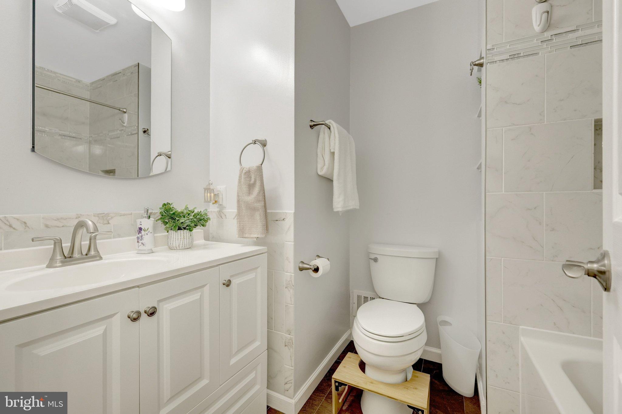 1008 Moore Place Southwest Vienna, VA 22180 - Photo 33 of 55 a bathroom with a toilet sink and shower