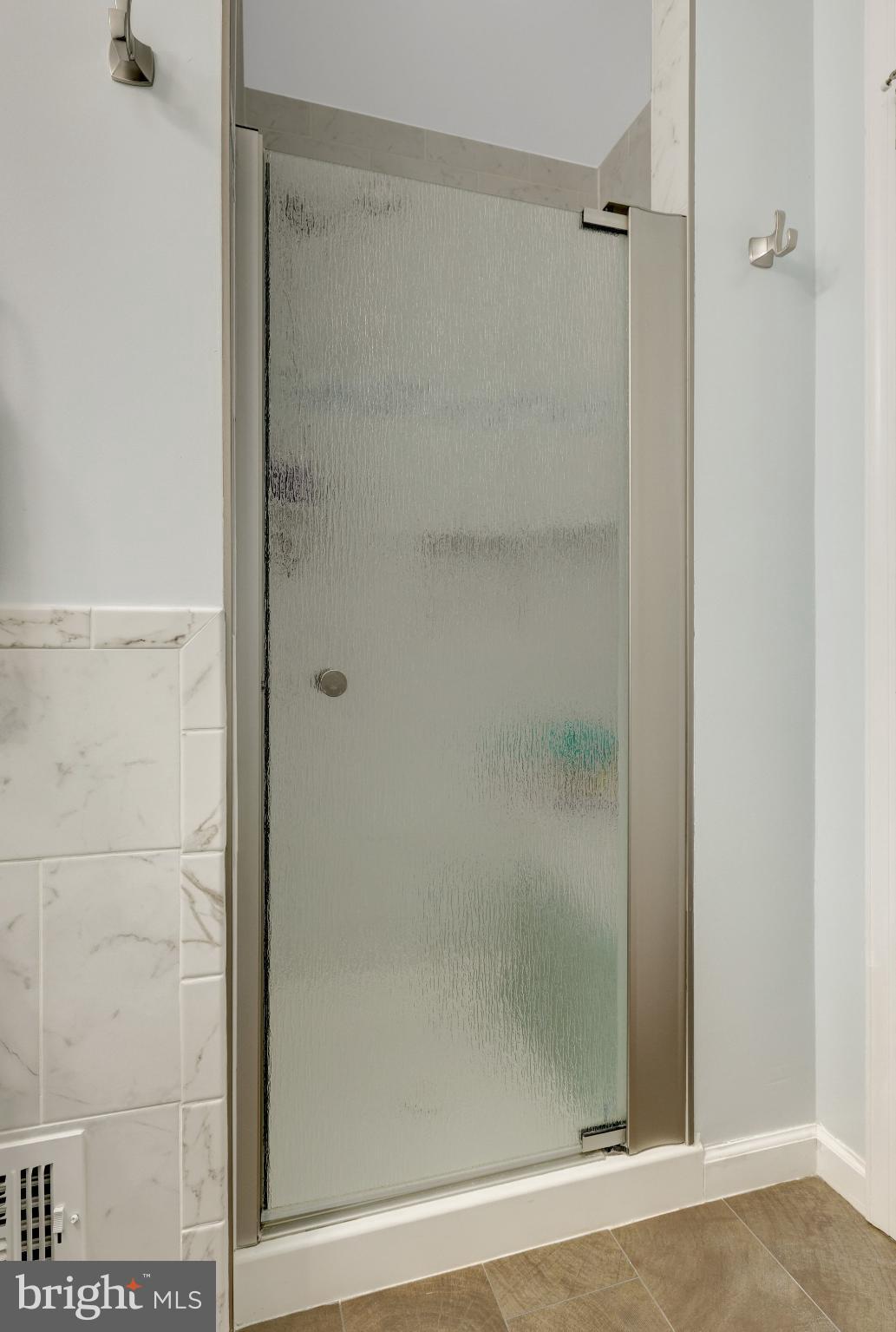 1008 Moore Place Southwest Vienna, VA 22180 - Photo 45 of 55 a bathroom with a glass shower door