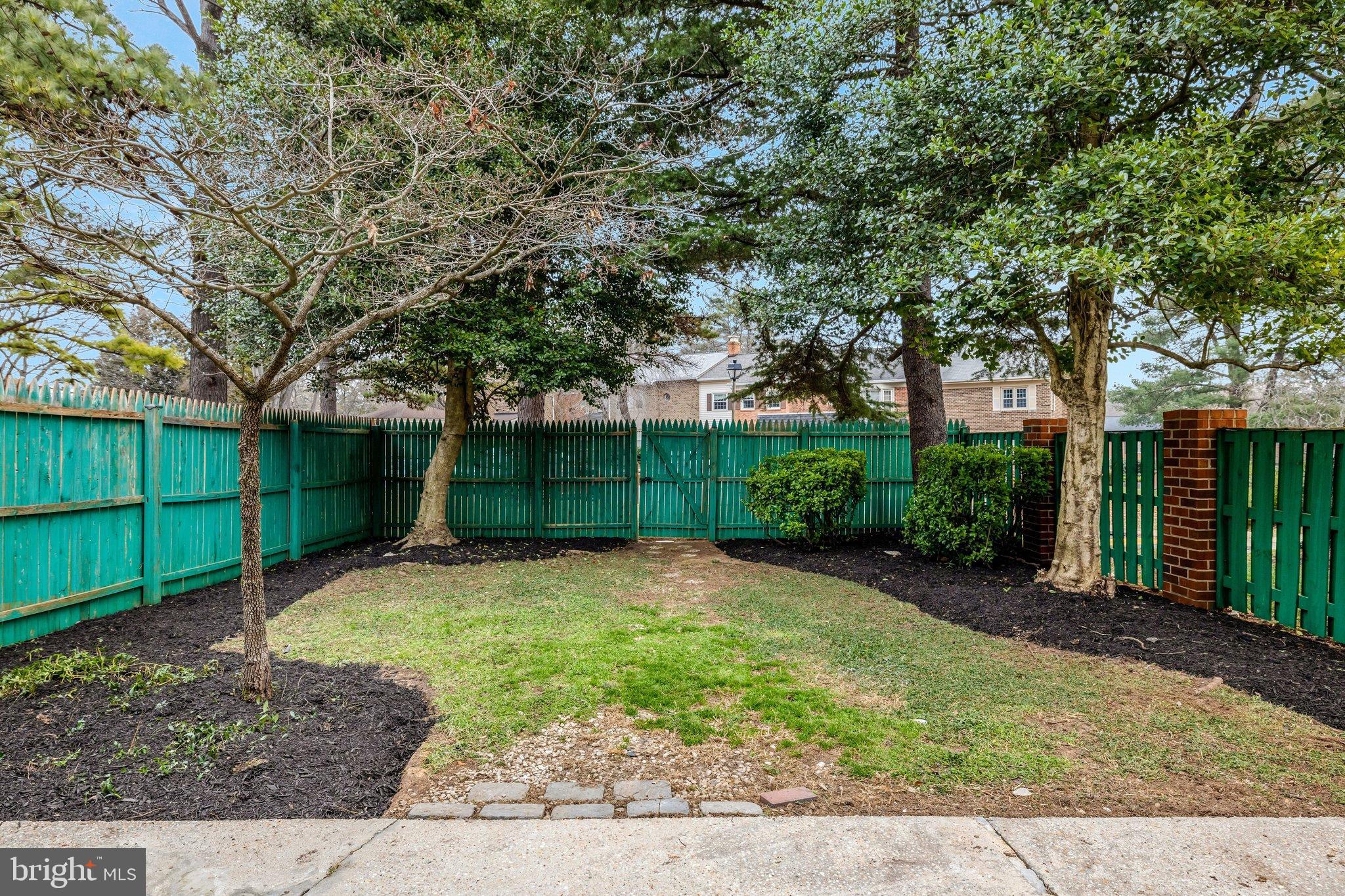 1008 Moore Place Southwest Vienna, VA 22180 - Photo 48 of 55 a backyard of a house with lots of green space