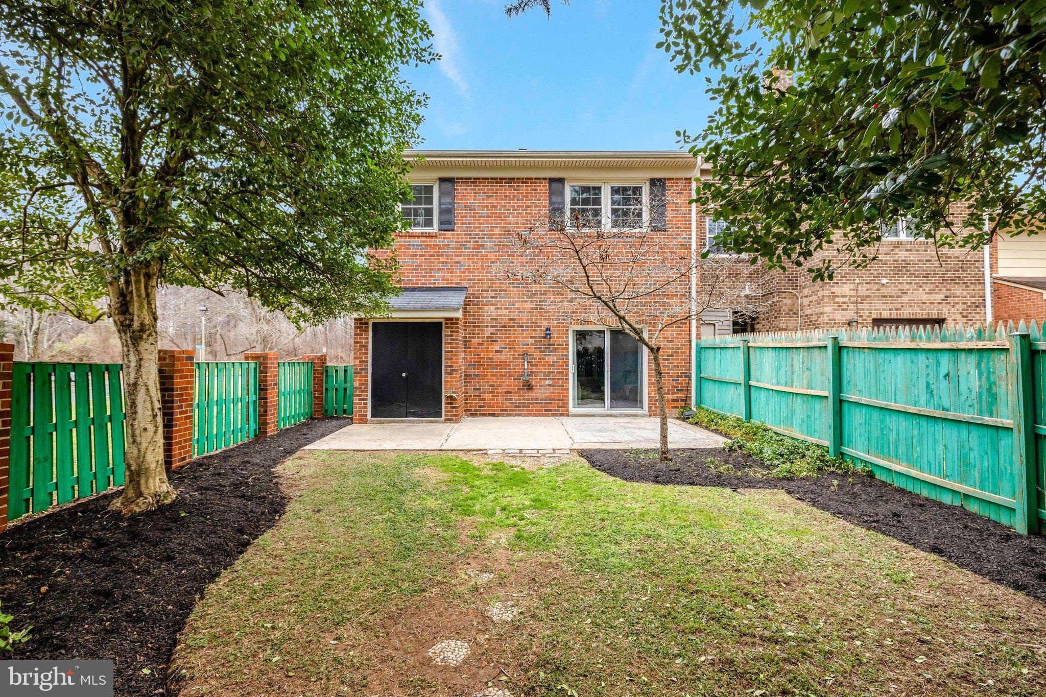 1008 Moore Place Southwest Vienna, VA 22180 - Photo 49 of 55 a front view of a house with a yard and garage