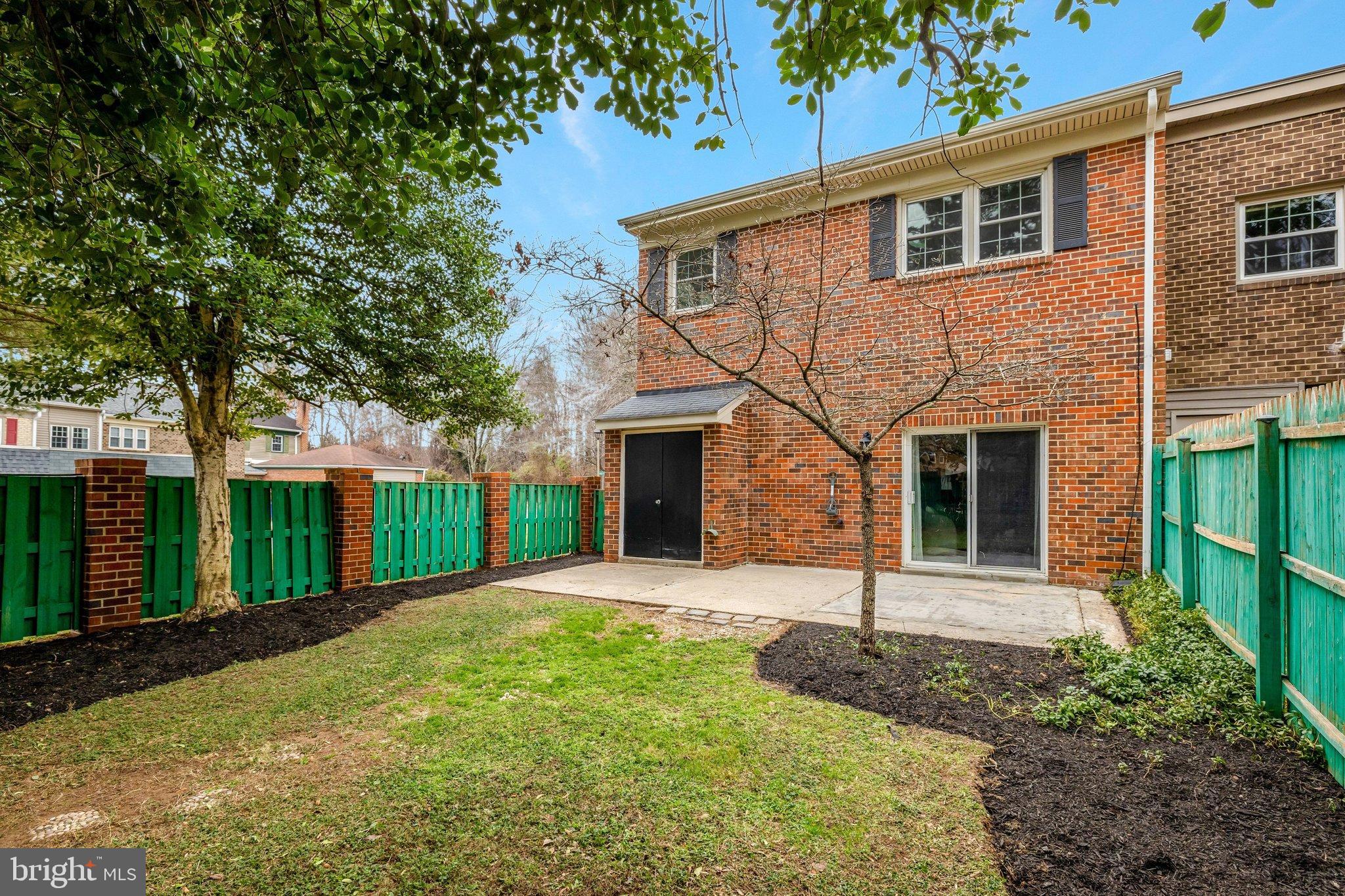 1008 Moore Place Southwest Vienna, VA 22180 - Photo 50 of 55 a front view of a house with yard and green space