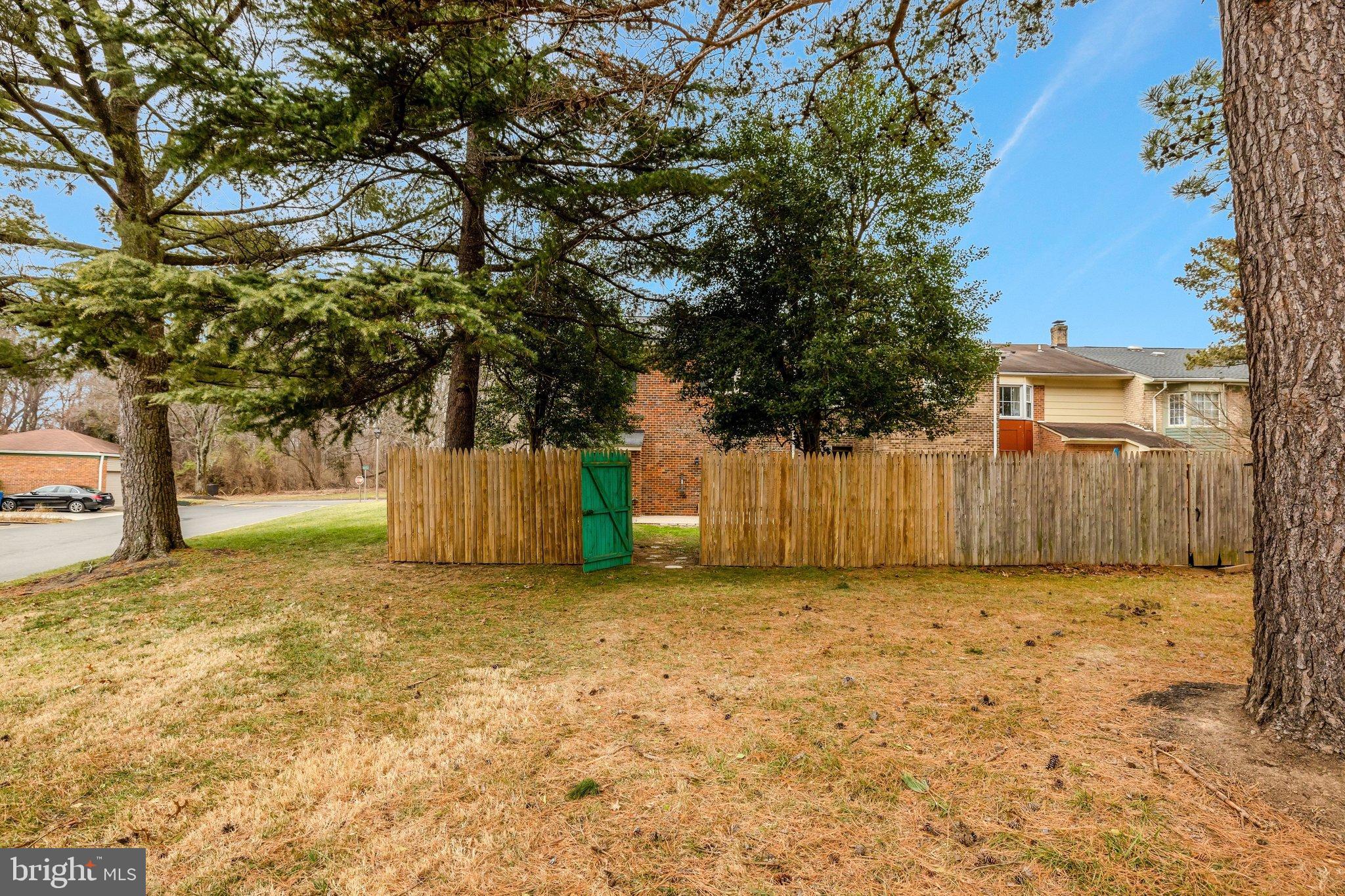1008 Moore Place Southwest Vienna, VA 22180 - Photo 51 of 55 a view of a house with a large tree and a yard