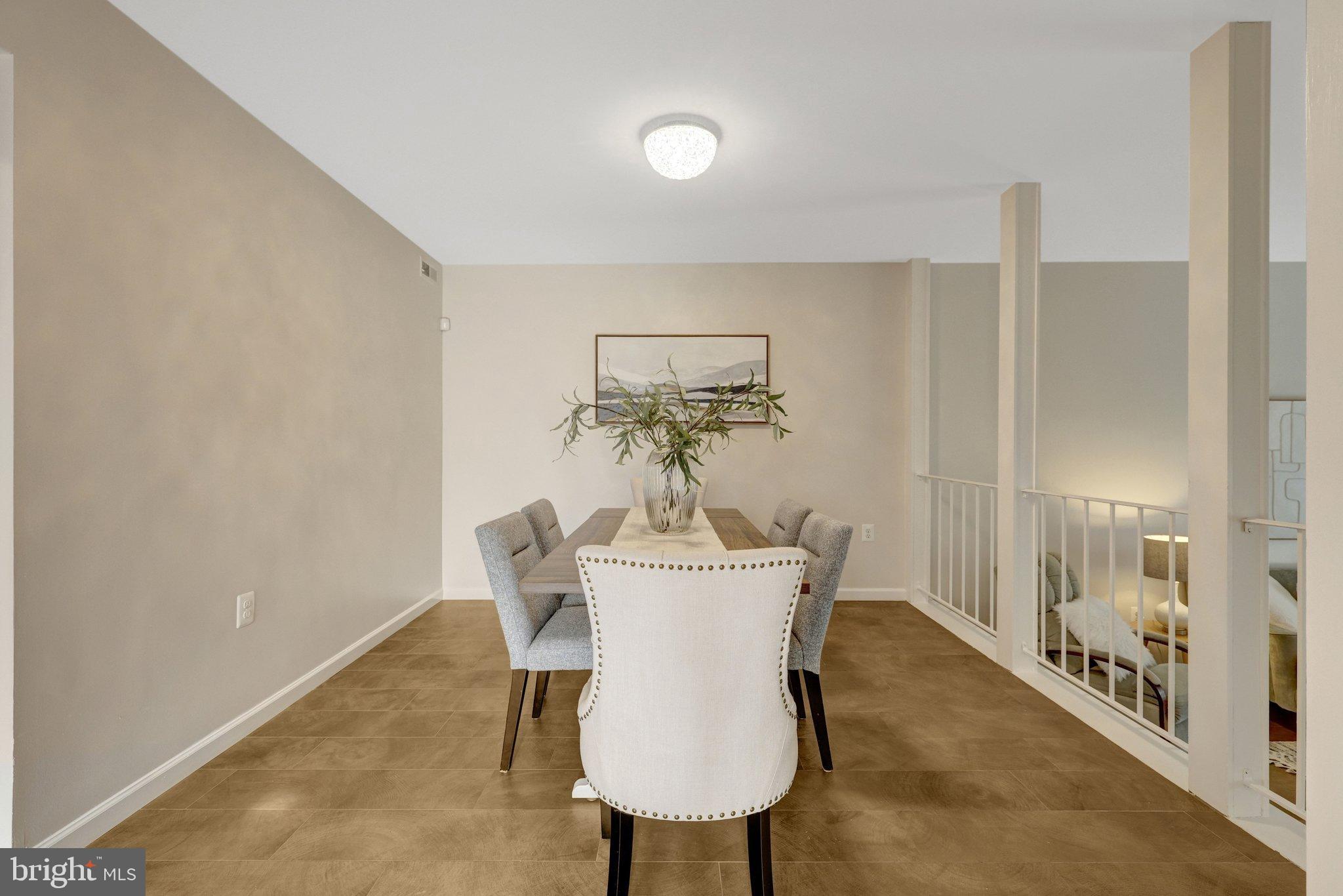 1008 Moore Place Southwest Vienna, VA 22180 - Photo 9 of 55 a view of a dining room with furniture and wooden floor