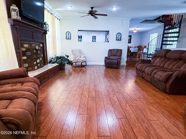 a living room with furniture and a fireplace