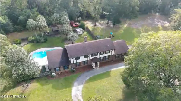 swimming pool with outdoor seating and yard