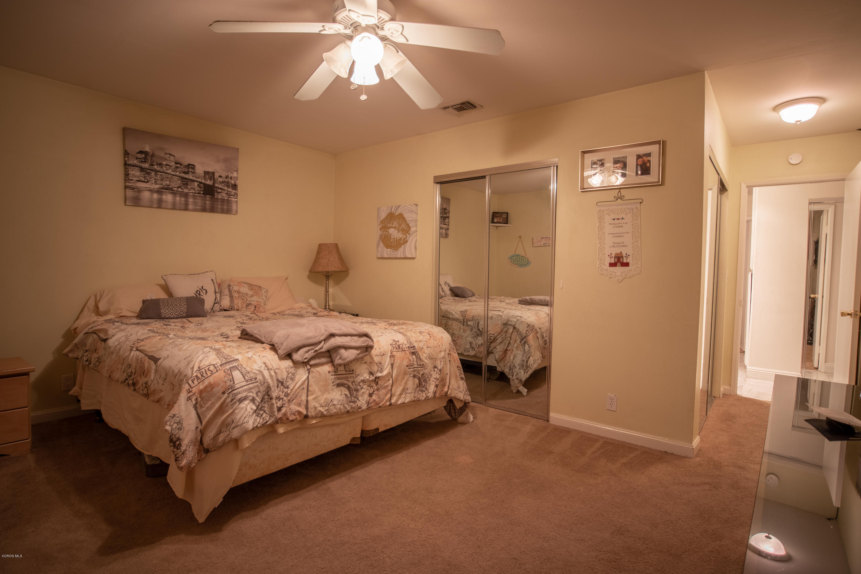 1113 Waltham Road Simi Valley, CA 93065 - Photo 12 of 20 a bedroom with a bed and a chandelier