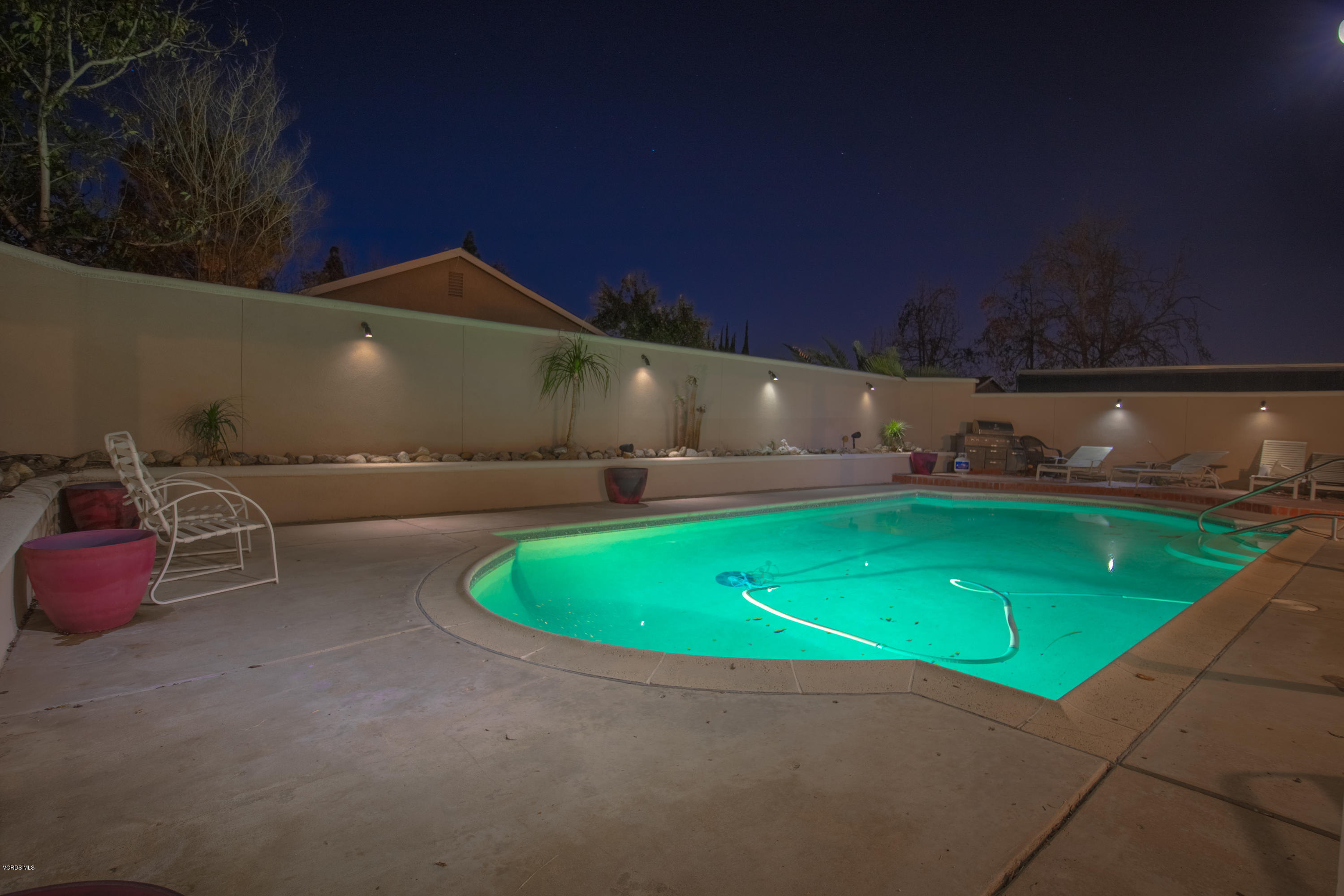 1113 Waltham Road Simi Valley, CA 93065 - Photo 20 of 20 a view of a backyard with table and chairs and a barbeque