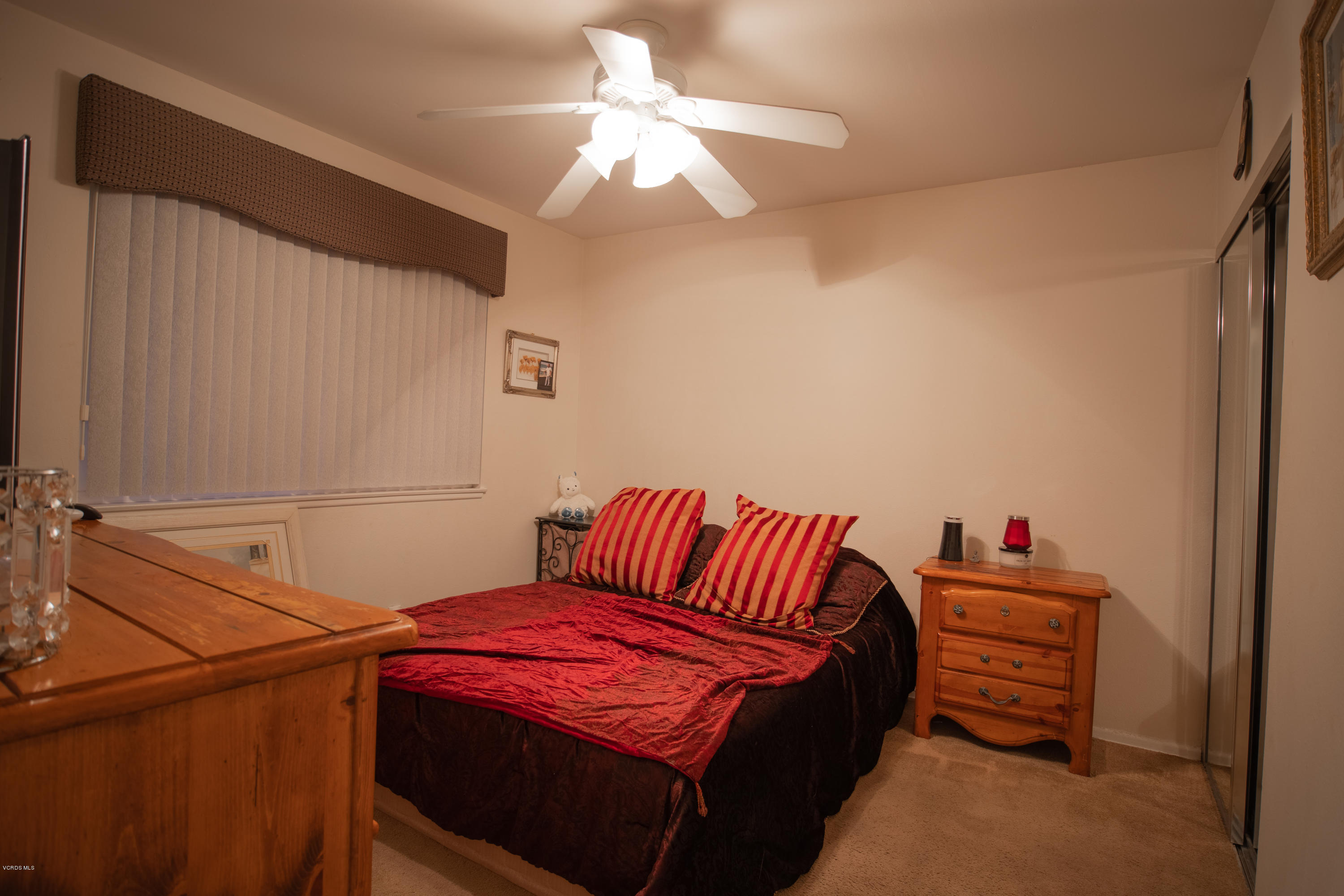 1113 Waltham Road Simi Valley, CA 93065 - Photo 10 of 20 a bedroom with a bed and a chandelier