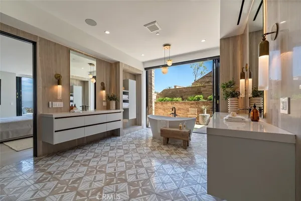 a very nice looking room with a large window and a fireplace