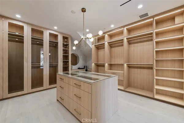 a kitchen with a stove a refrigerator and a sink