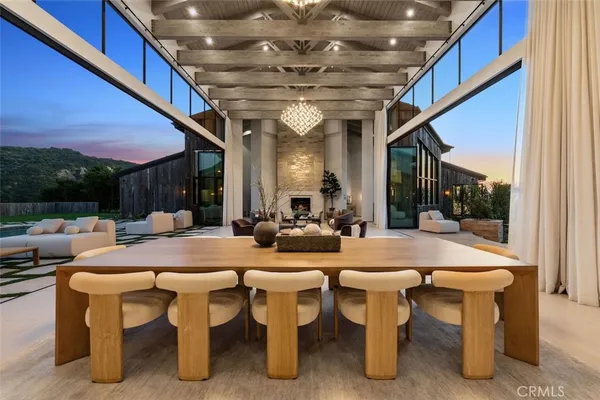 a view of a patio with table and chairs