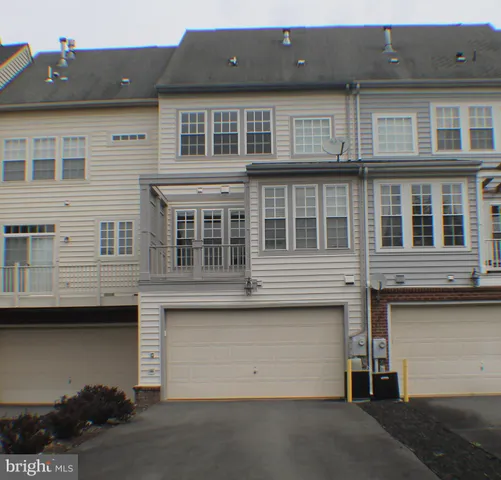 a front view of a house with a garage
