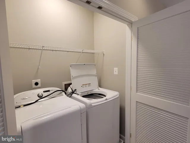 a view of a bath tub sitting in a bathroom