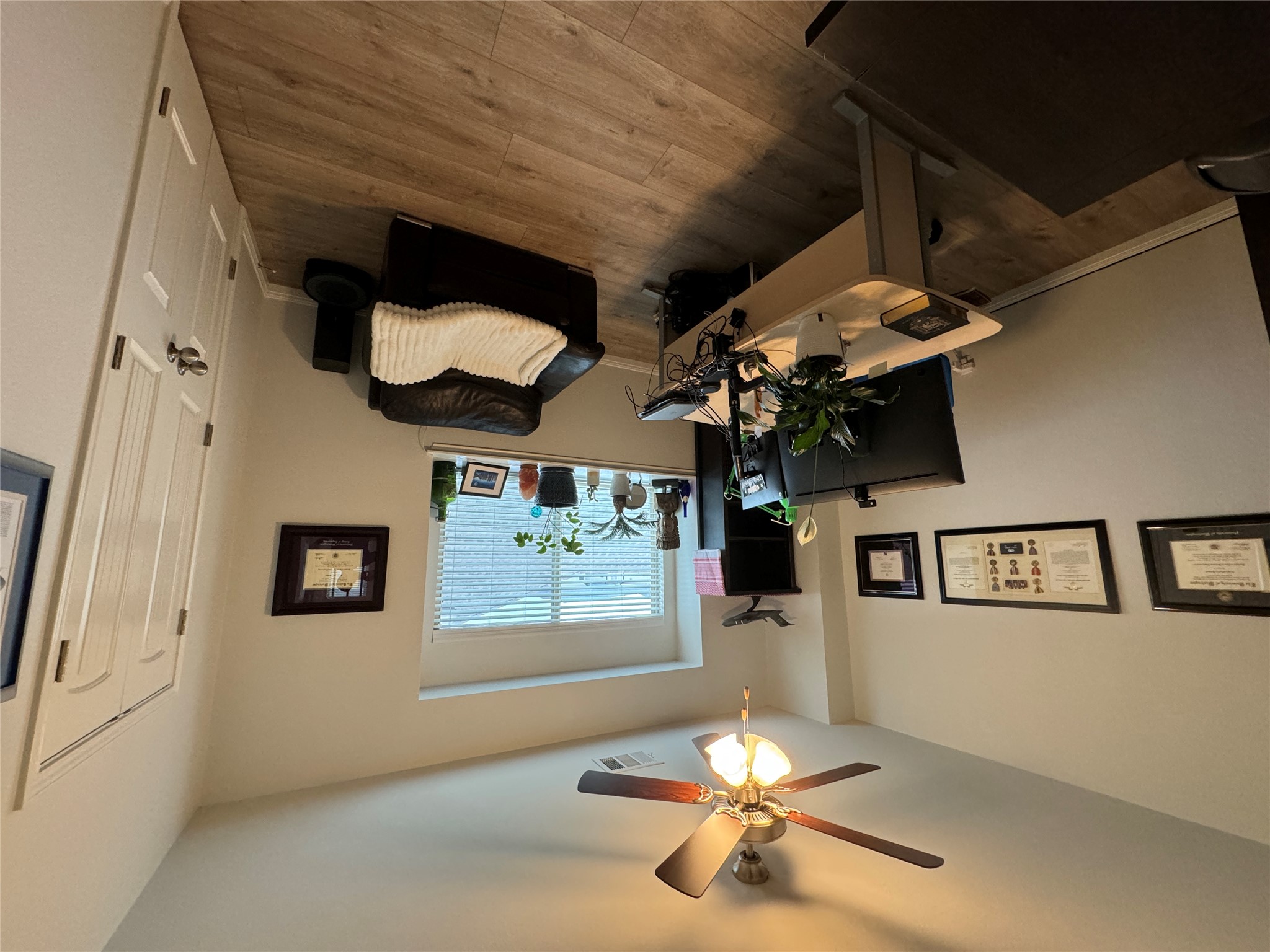 8145 Daisy Cutter Crossing Georgetown, TX 78626 - Photo 16 of 25 Bright room featuring wood-finish flooring, a ceiling fan with integrated lighting, and a window with horizontal blinds