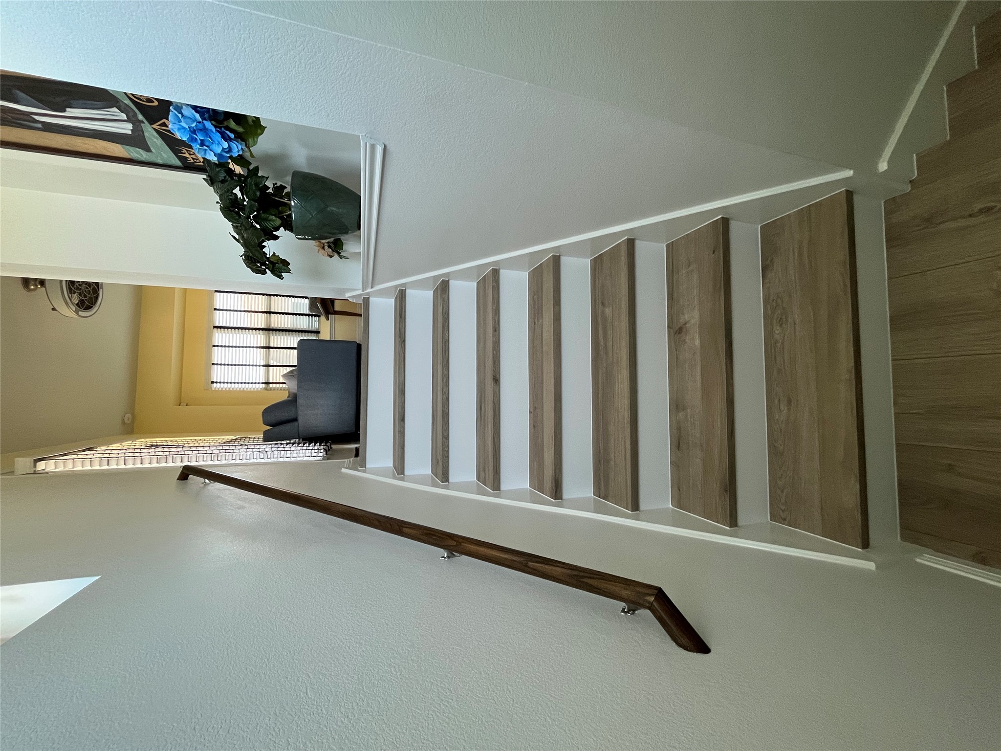 8145 Daisy Cutter Crossing Georgetown, TX 78626 - Photo 21 of 25 Staircase with wood-finish treads and white risers