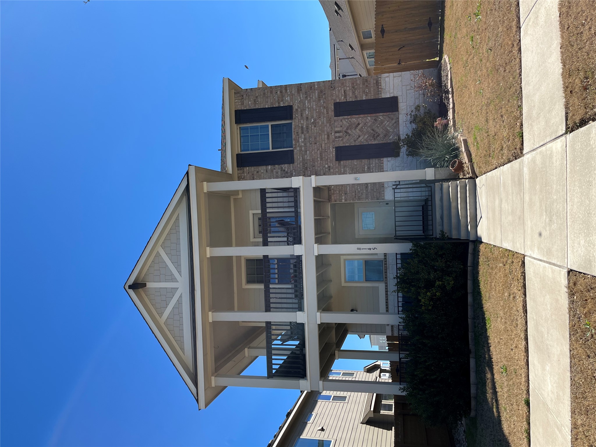 8145 Daisy Cutter Crossing Georgetown, TX 78626 - Photo 5 of 25 Two-story residence featuring a brick and siding facade with decorative shutters